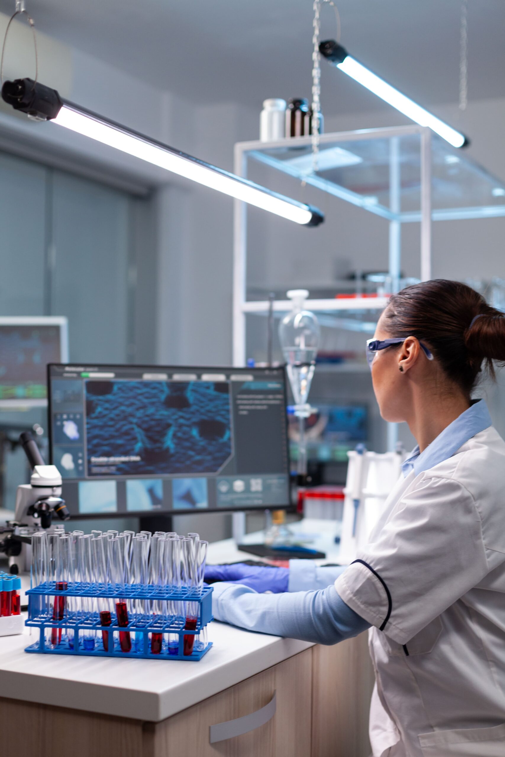 biochemistry-doctor-analyzing-virus-infection-developing-pharmaceutical-treatment-min